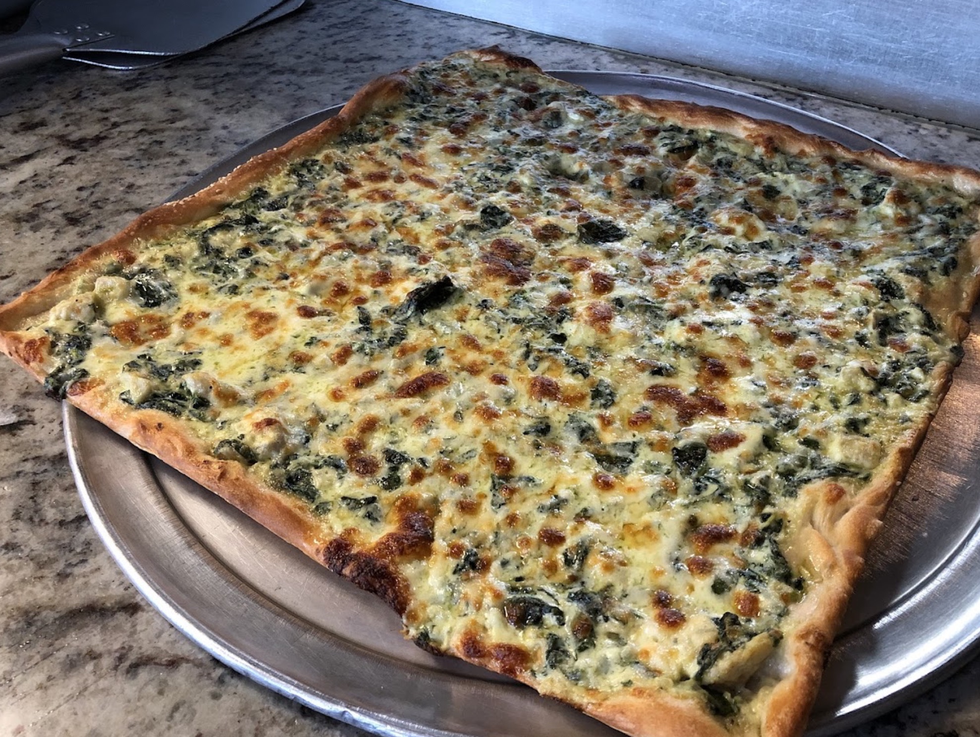 Square spinach pizza from Mozzarella's Pizza